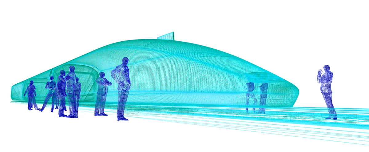 Engineers reviewing a vehicle model on a large screen